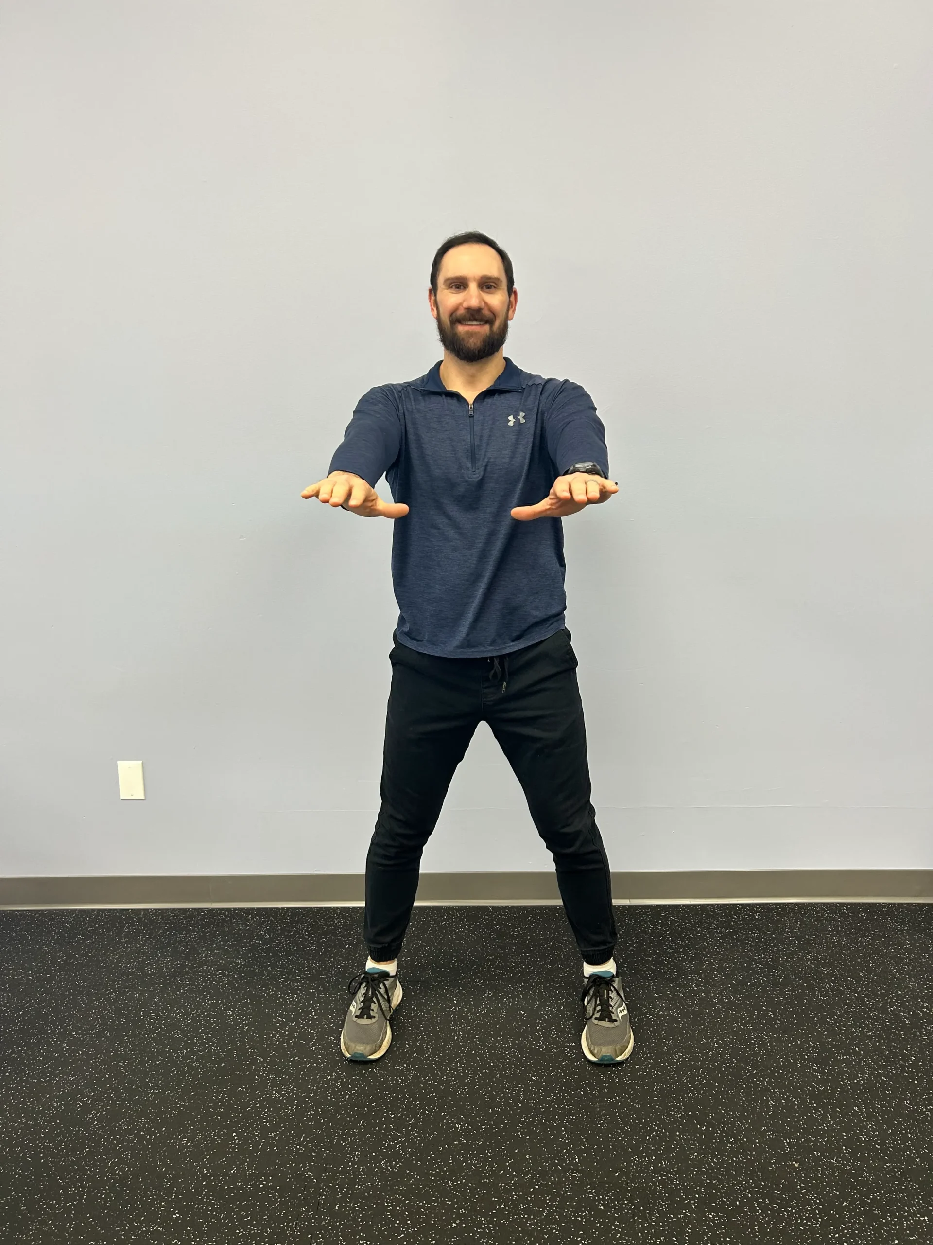 Man demonstrating squat.