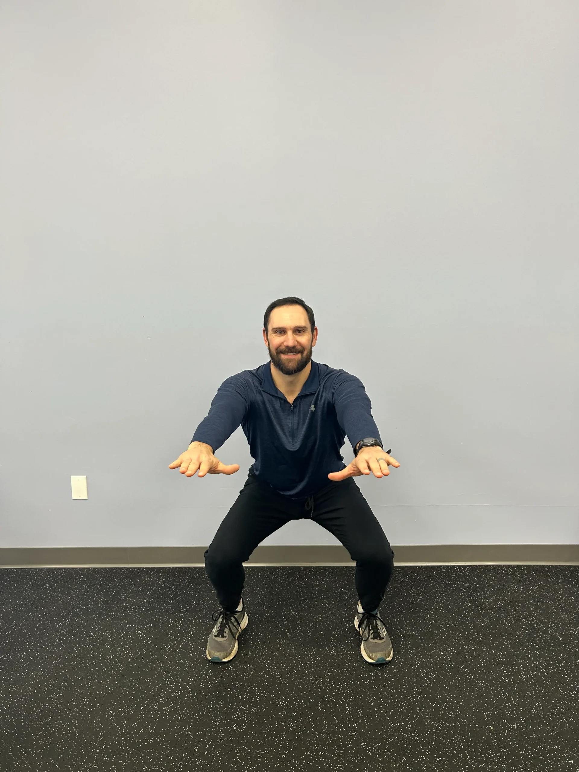 Man demonstrating squat.