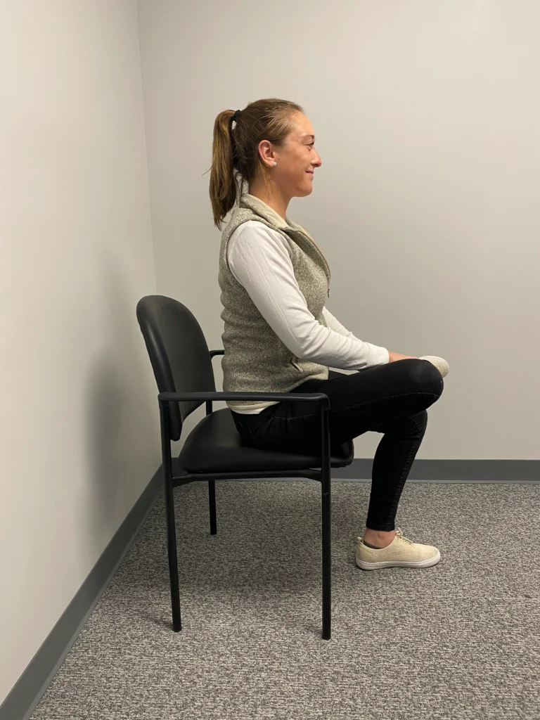 Women demonstrating Piriformis Stretch from a side view.