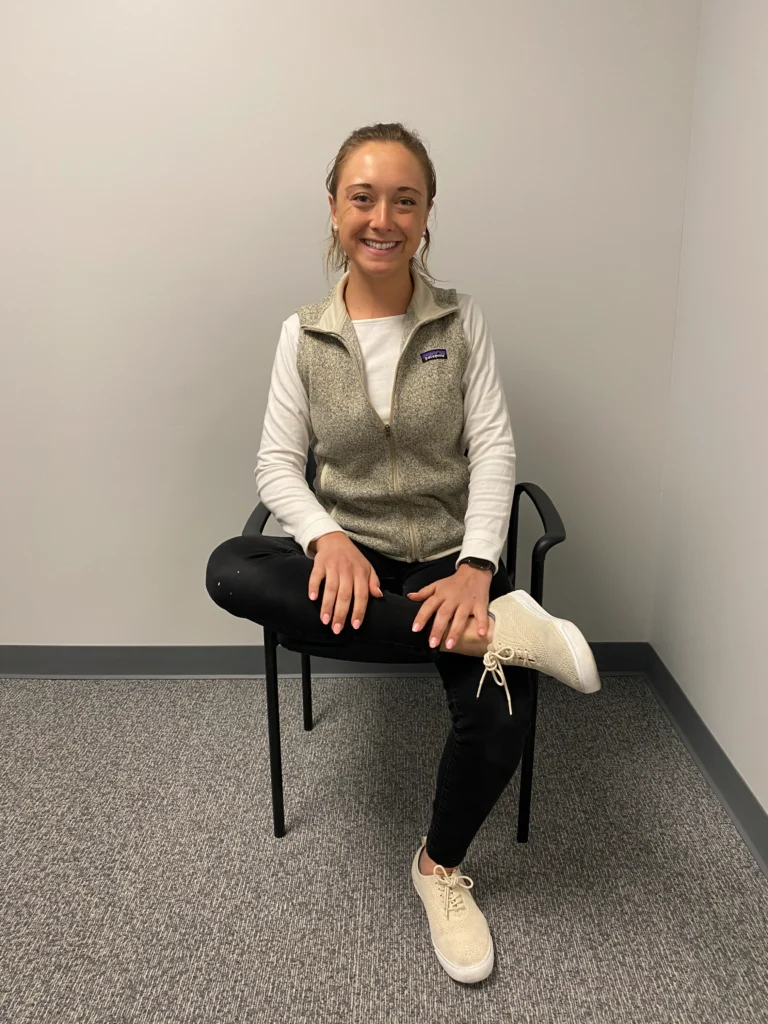 Women demonstrating Piriformis Stretch from a side view.